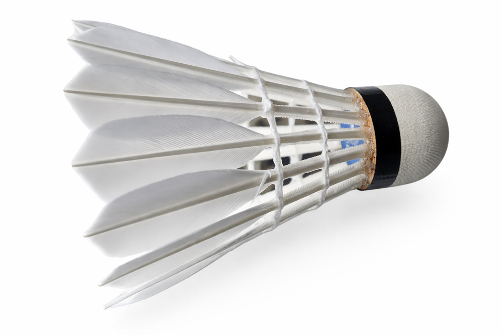 Close-up of a badminton shuttlecock on a white background